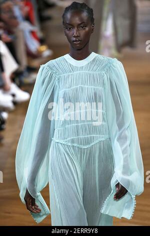 Looks Like Anok Yai walks on the runway during the Stella