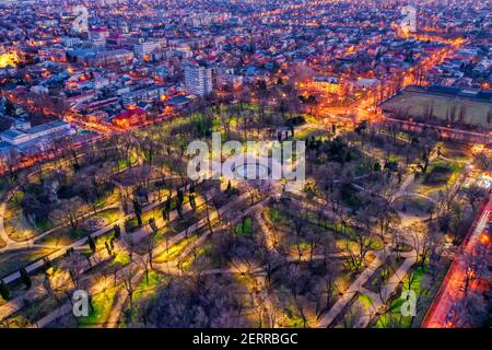 Galati, Romania - February 28, 2021: Aerial view of Galati City, Romania, at sunset with city lights on Stock Photo