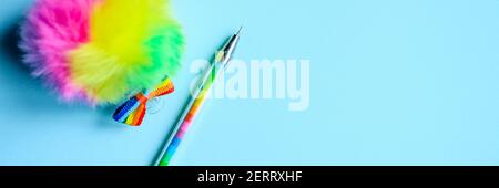 Colorful stationery. multicolored pen on blue background. banner Stock Photo
