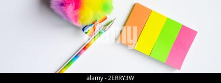 Colorful stationery. multicolored stickers and a pen on white background. banner Stock Photo