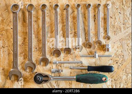 set of various repair hand tools or auto mechanic's tools. repair tool kit. equipment for building. wooden background, pattern, top view Stock Photo