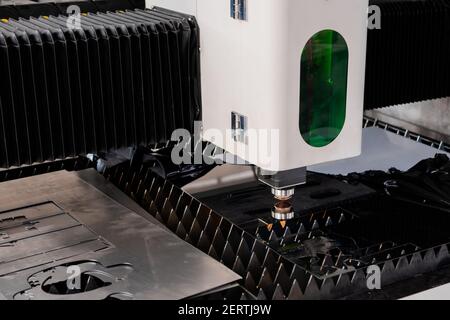 Automatic cnc laser cutting machine working with sheet metal at exhibition Stock Photo