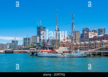 The Danish built tall ship Soren Larsen with Sydney central city in the background, moored at Campbell's Cove in Sydney Harbour, Australia Stock Photo