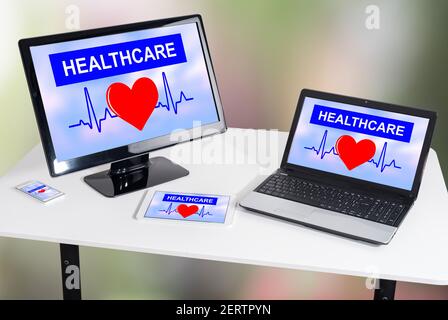 Healthcare concept shown on different information technology devices Stock Photo