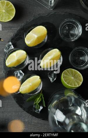 Concept of party drink with shots of vodka and blurred lights Stock Photo