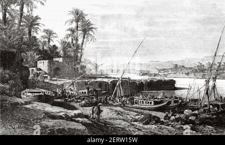 Panoramic view port at Aswan along the bank of the Nile, Egypt in XIX century. Africa. Old 19th century engraved illustration, El Mundo Ilustrado 1881 Stock Photo