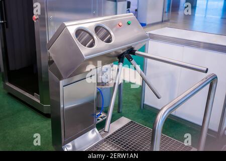 Hand hygiene station with turnstile gate before entering production area Stock Photo