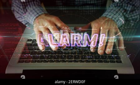 Alarm warning concept with exclamation symbol, danger, cyber attack and computer security breach icon. Camera moving with man typing on computer keybo Stock Photo