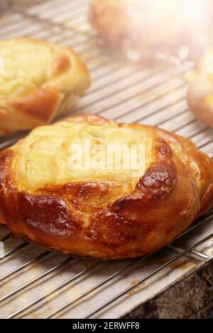 Fresh bun cake with pudding on a tray and empty space for text Stock Photo