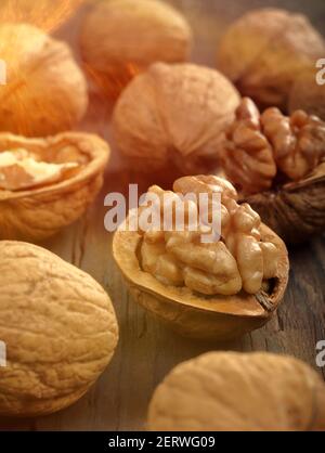Walnuts in shell on a wooden background and empty space for text Stock Photo