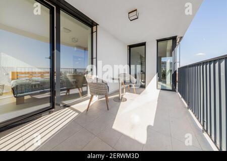 relaxing sitting on the terrace of a modern apartment Stock Photo