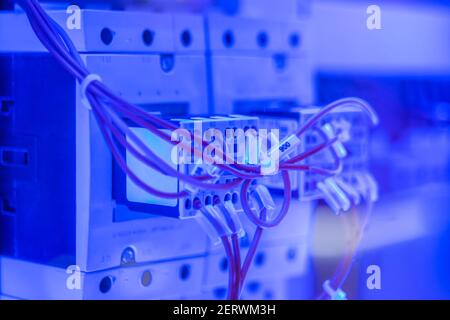 Contactor for switching electrical power circuit with blue illumination Stock Photo