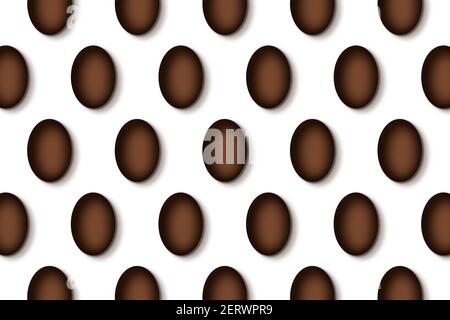 Chocolate Easter eggs pattern on white background. Stock Photo