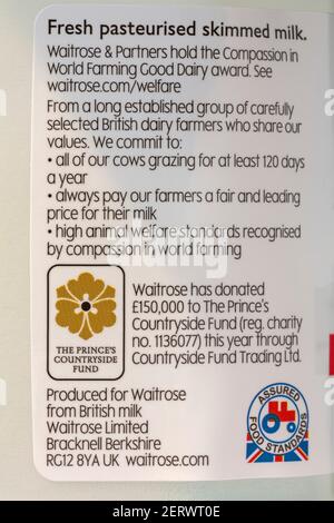 information on label on bottle of Essential Waitrose & Partners fresh pasteurised skimmed milk Stock Photo