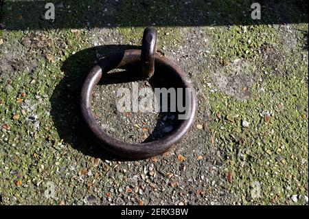 Old metal ring by the canal Stock Photo