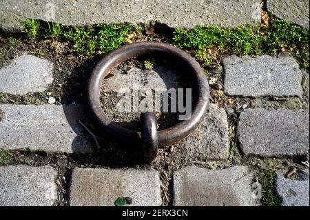 Old metal ring by the canal Stock Photo
