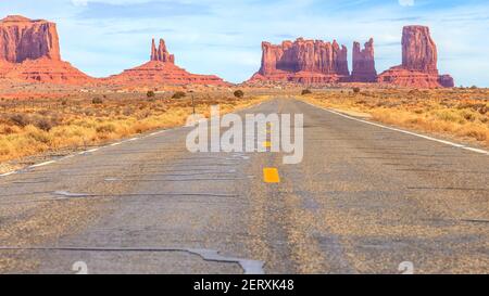 View to rocks of the Monument Valley alomg a road in the desert Stock Photo