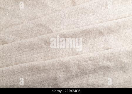 Fragment of white linen tissue. Top view, flat lay, natural textile background and texture. wave concept, abstract. Stock Photo