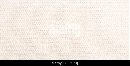 Fragment of smooth white linen tissue. Top view, flat lay, natural textile background and texture. Stock Photo