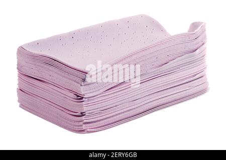 stack of pink liquidless and powderless laundry detergent squares sheets isolated on white background. Stock Photo