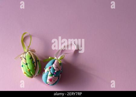 Easter eggs made of styrofoam, decorated with colorful fabric, copy space for text. Stock Photo