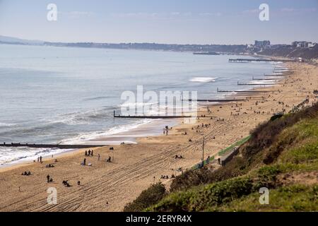 A view towards Boscombe and Bournemouth Piers over the beach at Fisherman’s Walk, Southbourne, Bournemouth on a beautifully sunny February day during Stock Photo