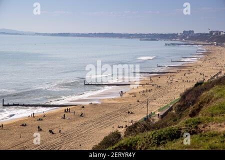 A view towards Boscombe and Bournemouth Piers over the beach at Fisherman’s Walk, Southbourne, Bournemouth on a beautifully sunny February day during Stock Photo