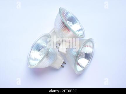 Three low voltage halogen lamps for ceiling lamps lamps on a white background. Stock Photo