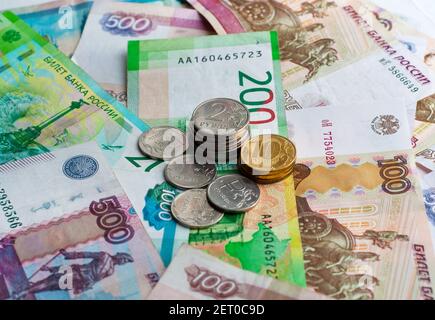 Money of Russia. Banknotes and coins. Close-up of Russian rubles of various denominations. Finance concept. Stock Photo