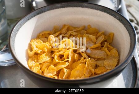 Breakfast outdoors with bowl of Cornflakes UK Stock Photo