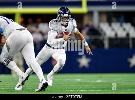 November 05, 2018:.Tennessee Titans quarterback Marcus Mariota (8)  scrambles for a first down during an NFL football game between the  Tennessee Titans and Dallas Cowboys at AT&T Stadium in Arlington, Texas.  Manny