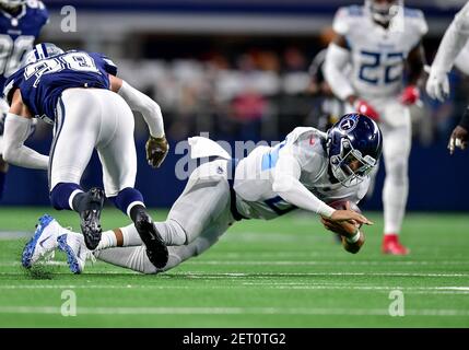 November 05, 2018:.Tennessee Titans quarterback Marcus Mariota (8)  scrambles for a first down during an NFL football game between the  Tennessee Titans and Dallas Cowboys at AT&T Stadium in Arlington, Texas.  Manny