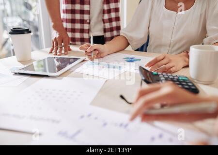 Business people discussing reports Stock Photo