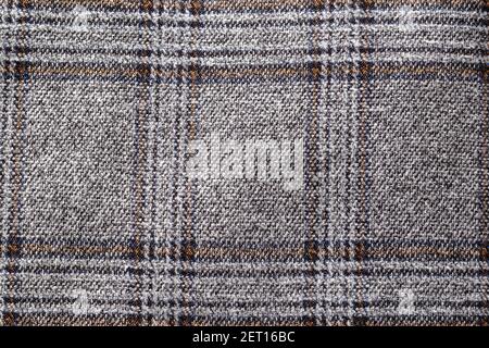 Background from gray checkered fabric, close-up. Fashion Stock Photo