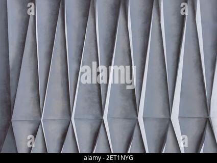 Geometric texture on the facade of the house. Triangular shapes. Stock Photo