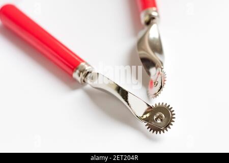 two leather sewing tools on a white background Stock Photo