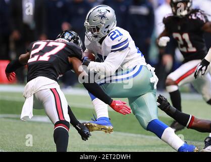 Dallas Cowboys' Osa Odighizuwa (97) and Damontae Kazee (18) celebrate with  Trevon Diggs (7) after Diggs intercepted a pass in the second half of an  NFL football game against the Carolina Panthers