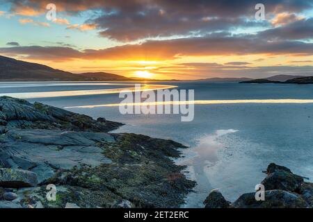 Beautiful sunset at low tide over Luskentyre beach on the Isle of Harris in the Western Isle of Scotland Stock Photo
