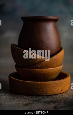 Stack of rustic bowls on a table on a wooden table Stock Photo