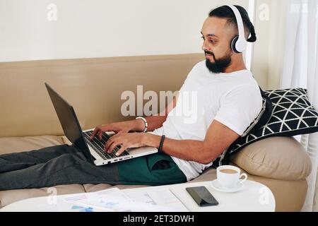 Man working on laptop Stock Photo