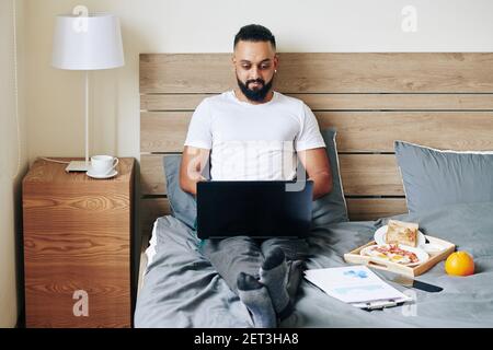 Man enjoying working from home Stock Photo