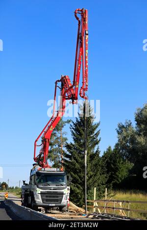 Putzmeister truck mounted concrete pump of Swerock at work site on a bridge over Paimionjoki river. Road 224, Marttila, Finland. August 21, 2020. Stock Photo