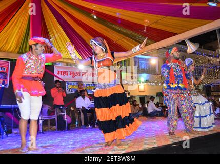 Folk artist perform during Maha Murkh Sammelan (Grand Foolish Conference) on the night of Holi festival in Beawar, Rajasthan. Photo: Sumit Saraswat Stock Photo