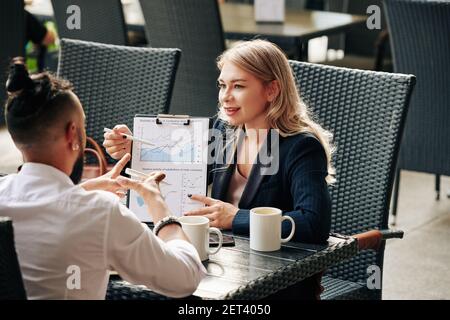 Colleagues discussing business activity Stock Photo