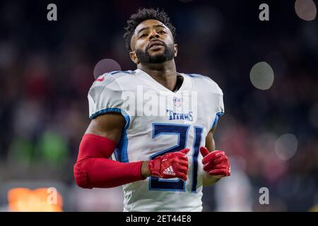 Houston Texans vs. Tennessee Titans. NFL Game. American Football League  match. Silhouette of professional player celebrate touch down. Screen in  background. Stock Photo