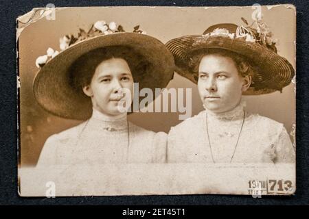 Germany - CIRCA 1912: Photo of two young women wearing hats. Vintage Carte de Viste Edwardian era photo Stock Photo