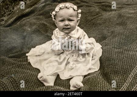 Latvia - CIRCA 1940s: Portrait of baby girl in studio. Vintage archive Art Deco era photography Stock Photo