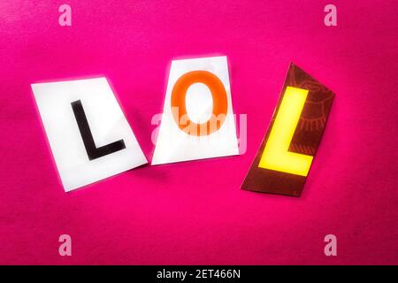 The acronym "LOL"  (Laugh Out Loud) using cut-out paper letters in the ransom note effect typography, USA Stock Photo