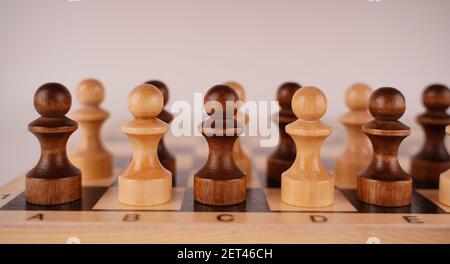 Close-up of chess on a blue background. Wooden chess pieces. Concept: the Board game and the intellectual activities Stock Photo