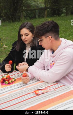 Young couple enjoying a nice afternoon together. Sharing good times enjoying a drink. Stock Photo
